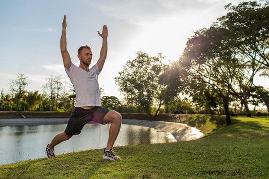 Morning flexibility and mobility routine in an outdoor park by the water